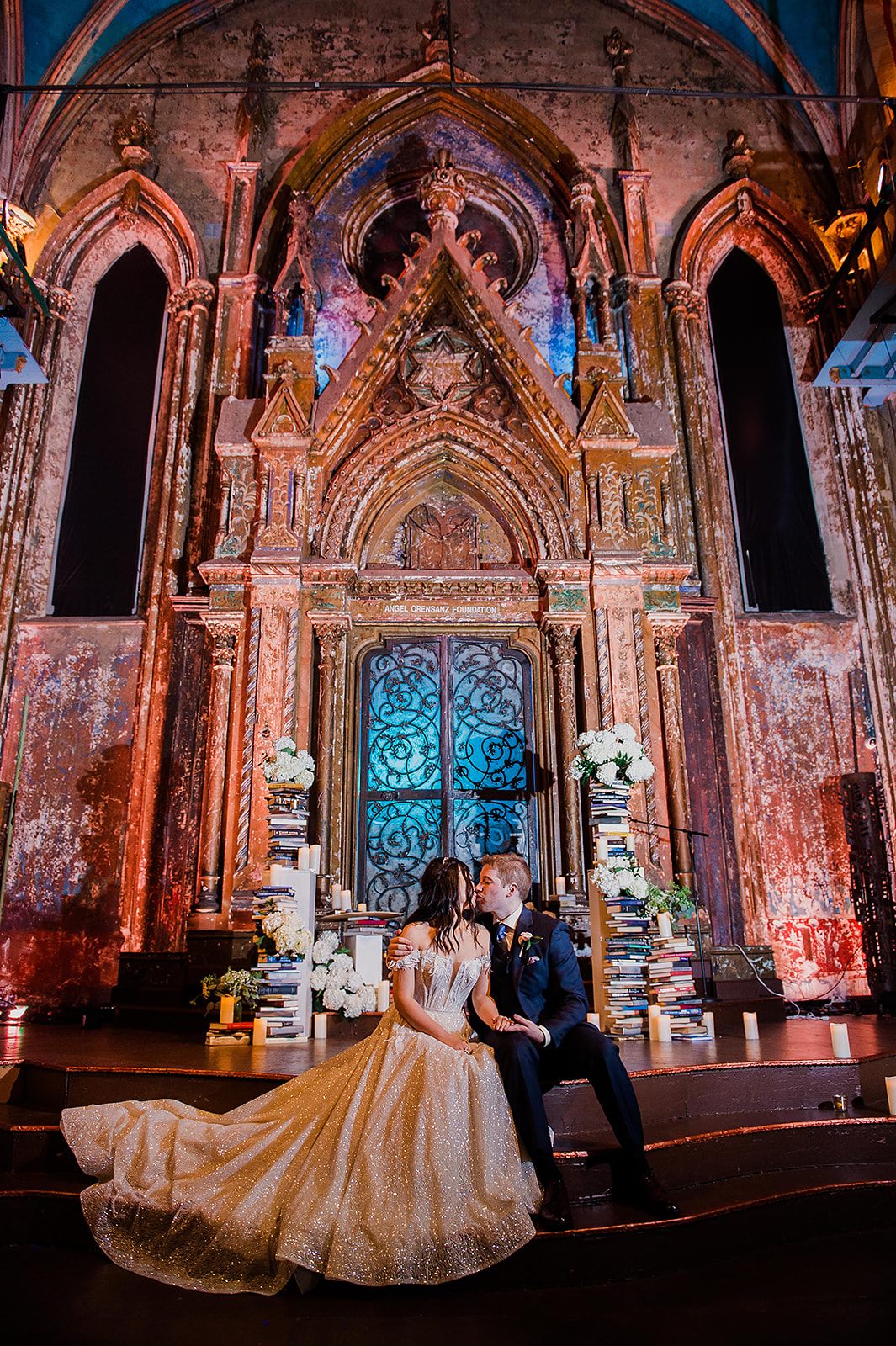 At the gilded altar, lit in amber