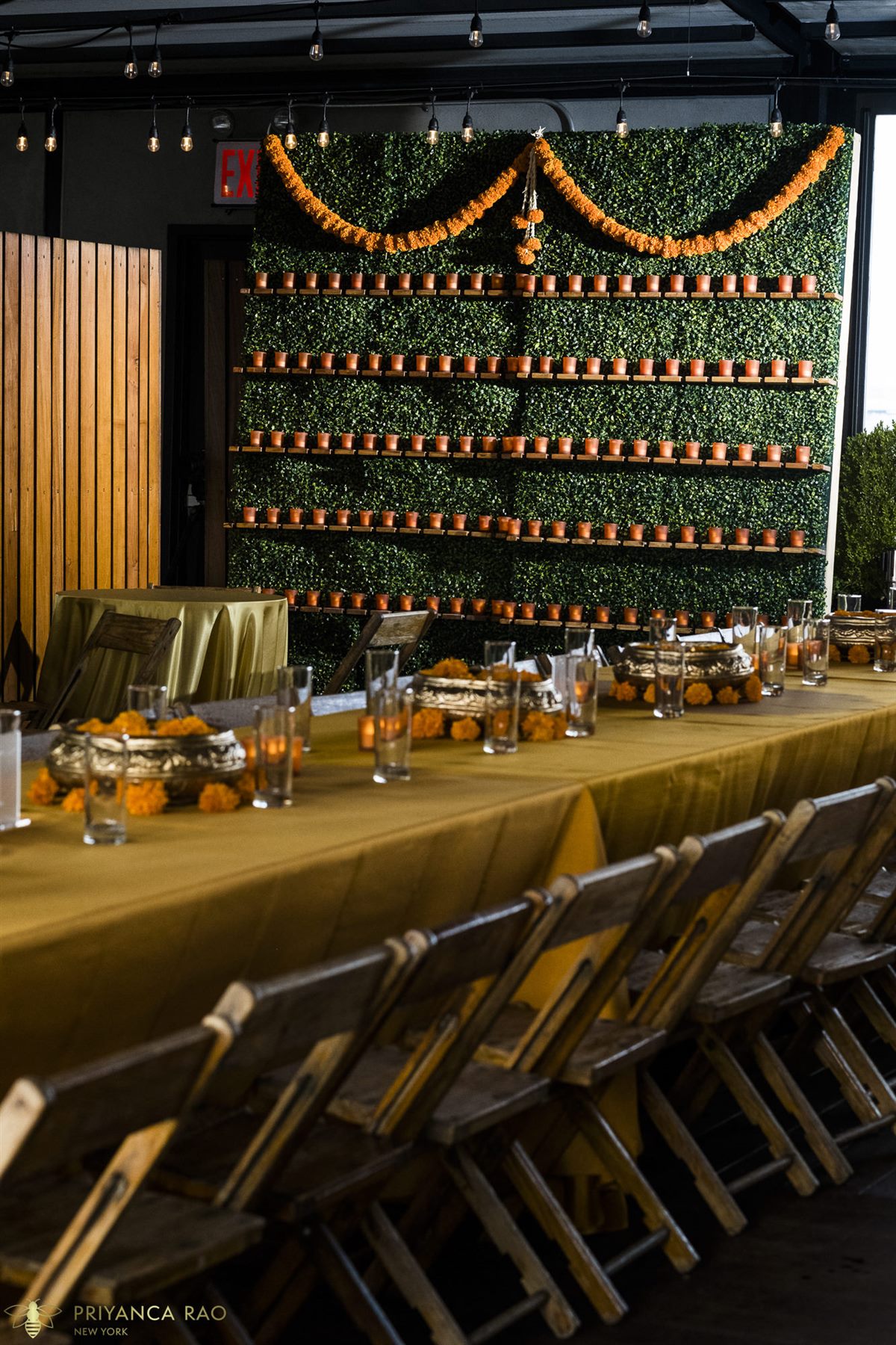 A wall of diyas and marigolds