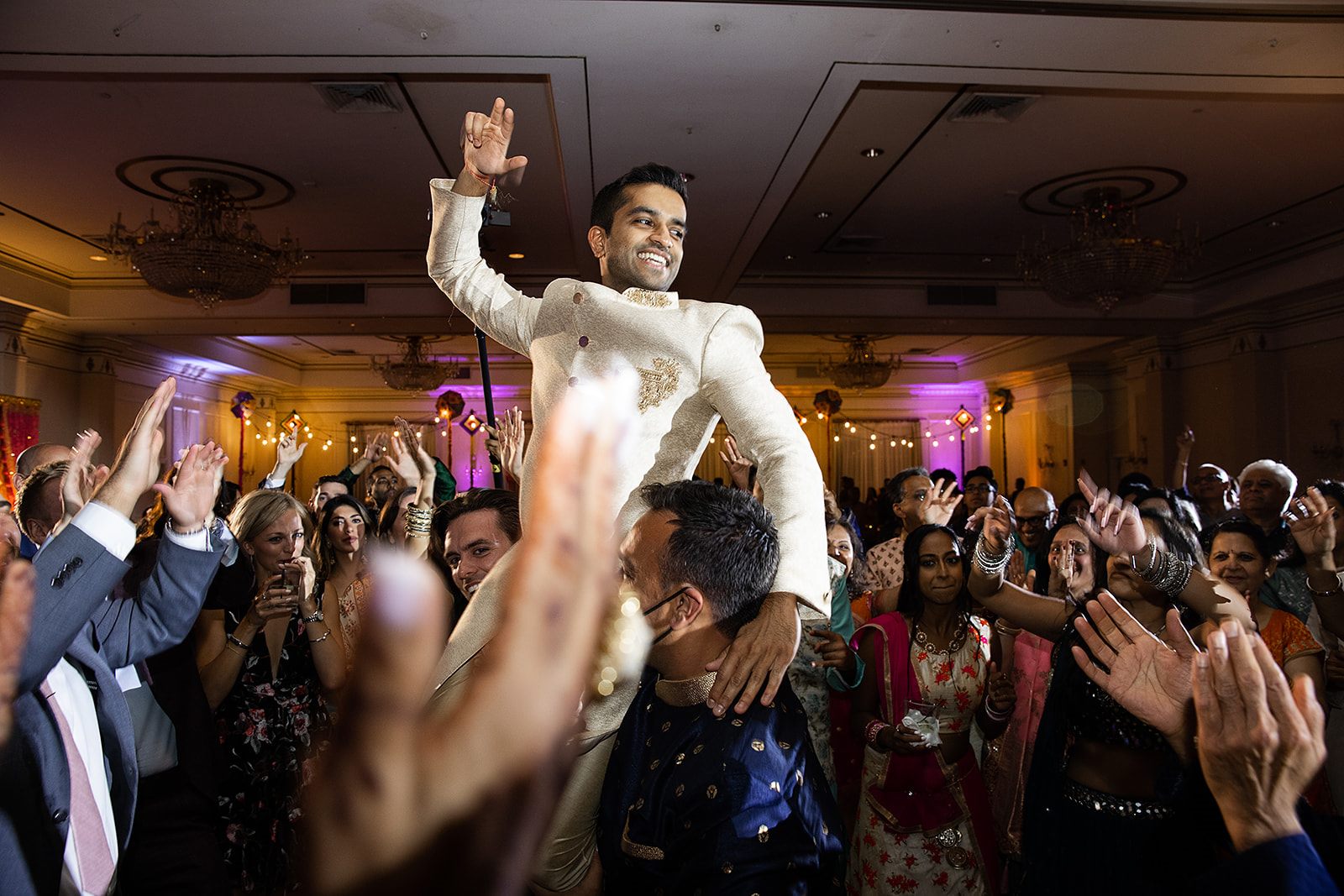 The groom, lifted at the sangeet