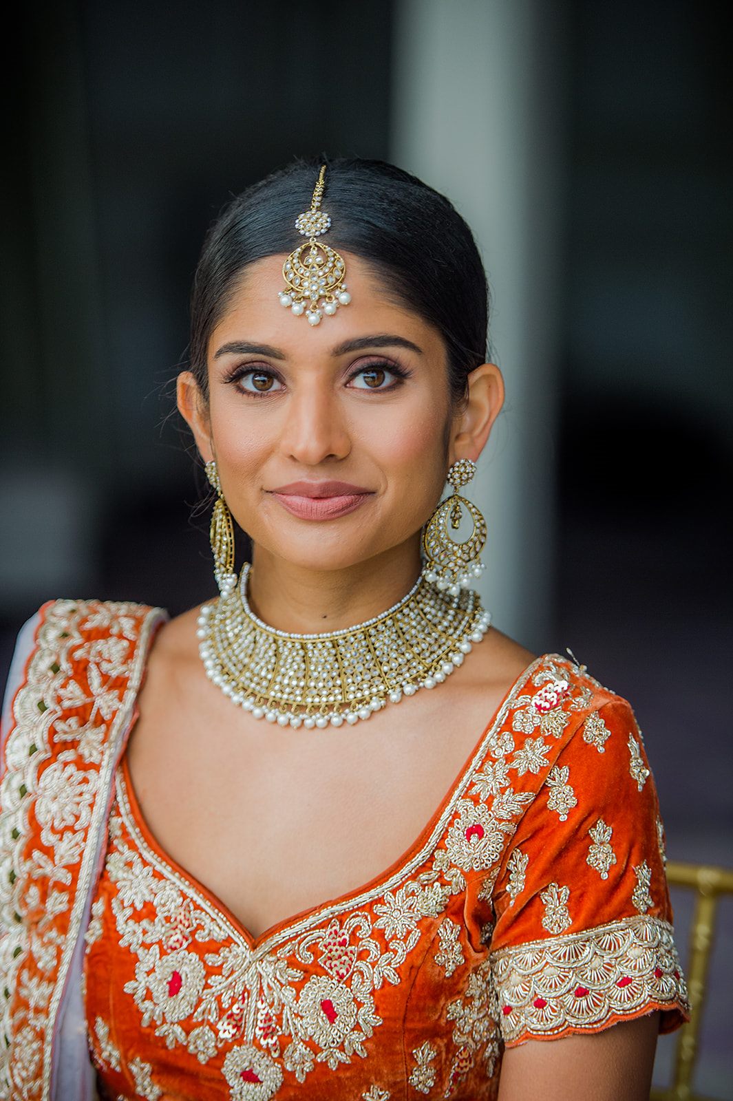The bride in marigold velvet and pearl