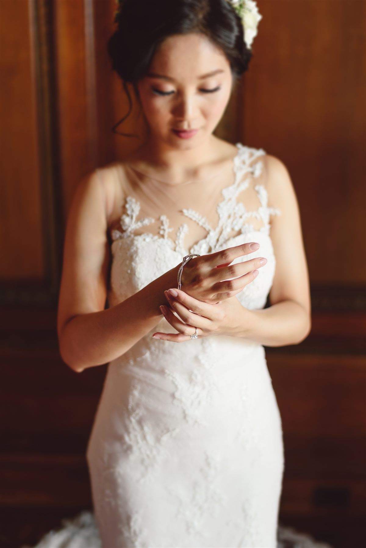 The bride, gown fastened