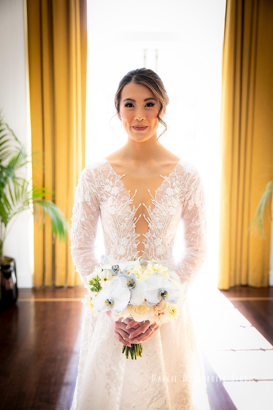 The bride at the gold curtains