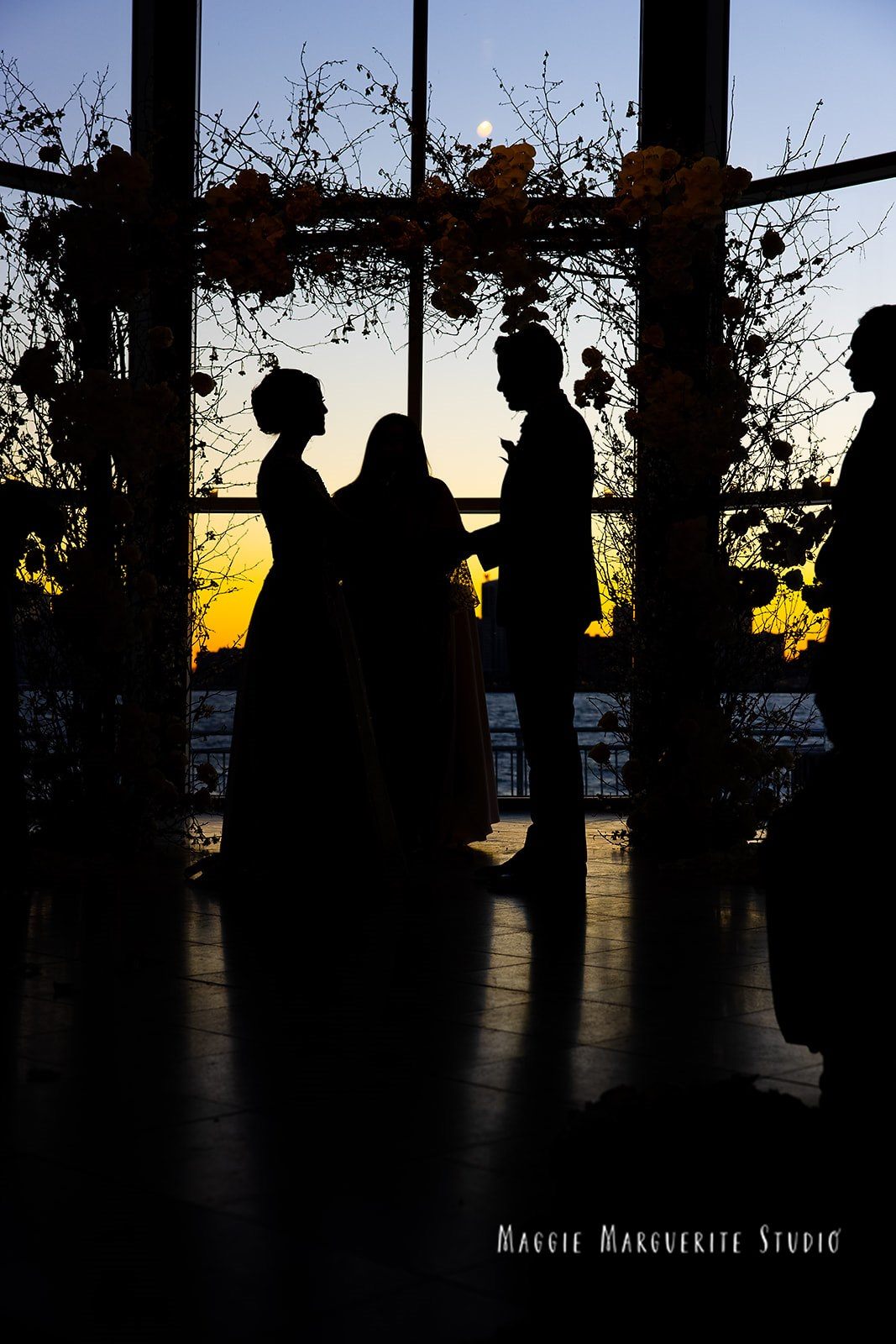 Vows in silhouette as the sun goes down
