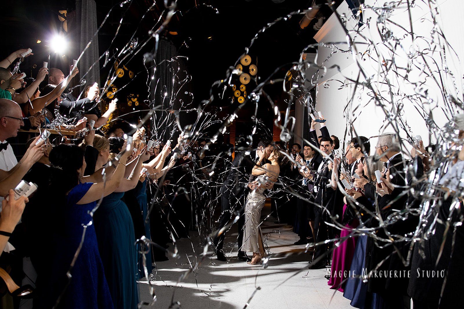 The send-off, silver streamers over the last kiss