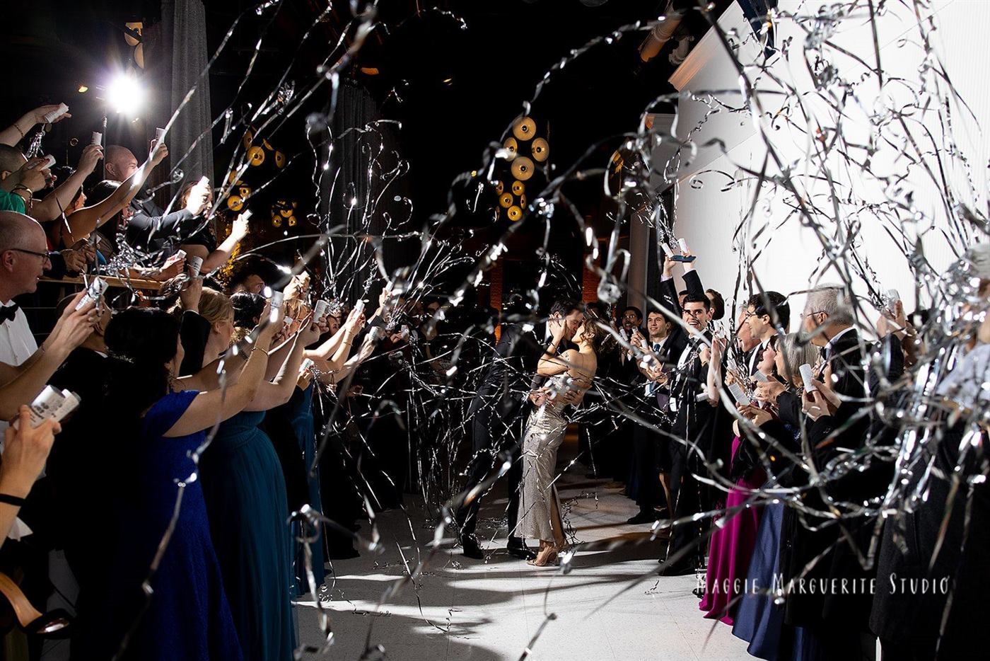 The send-off, silver streamers over the last kiss